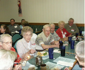 The Class of 1938 enjoys a meal and conversation.