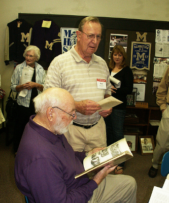 Another of the many yearbooks the Alumni Center contains gets checked out during the '45 & '46 reunion.
