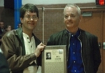 Bill Murray displays the plaque he received on behalf of Del Close along with Howard Johnson, author of The Funniest One in the Room: The Lives and Legends of Del Close.