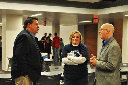 Lynn Meridith, right, talks with MHS principal Terry McCarty, left, and Michele Jones.