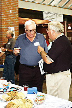 Dave Fiser and Charlie Hostetler at the social table during the social portion of the Wall of Fame dedication.