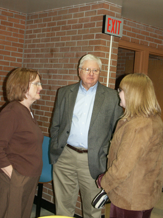 Diane Gaede-Shilling '65 and Jayne (Foster) Peterson '66, two of a group of classmates and friends of Tom Romig, talk with Roger Brannon, former MHS teacher, debate coach, and influence in the life of Hall of Fame Honoree Mike Silva.