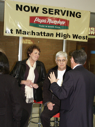 MHSAA Wall of Fame Chairman Dan Hall '70 talks to relatives of Clemetine Paddleford, from left Joan Blakeley and Mary Jo Hageman.